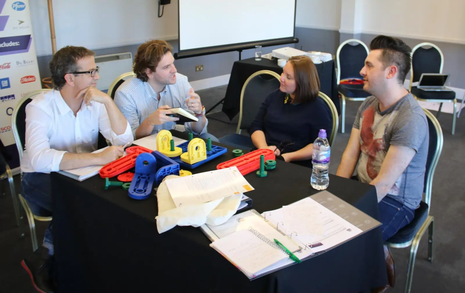 Team of line managers developing coaching skills using an MTa kit