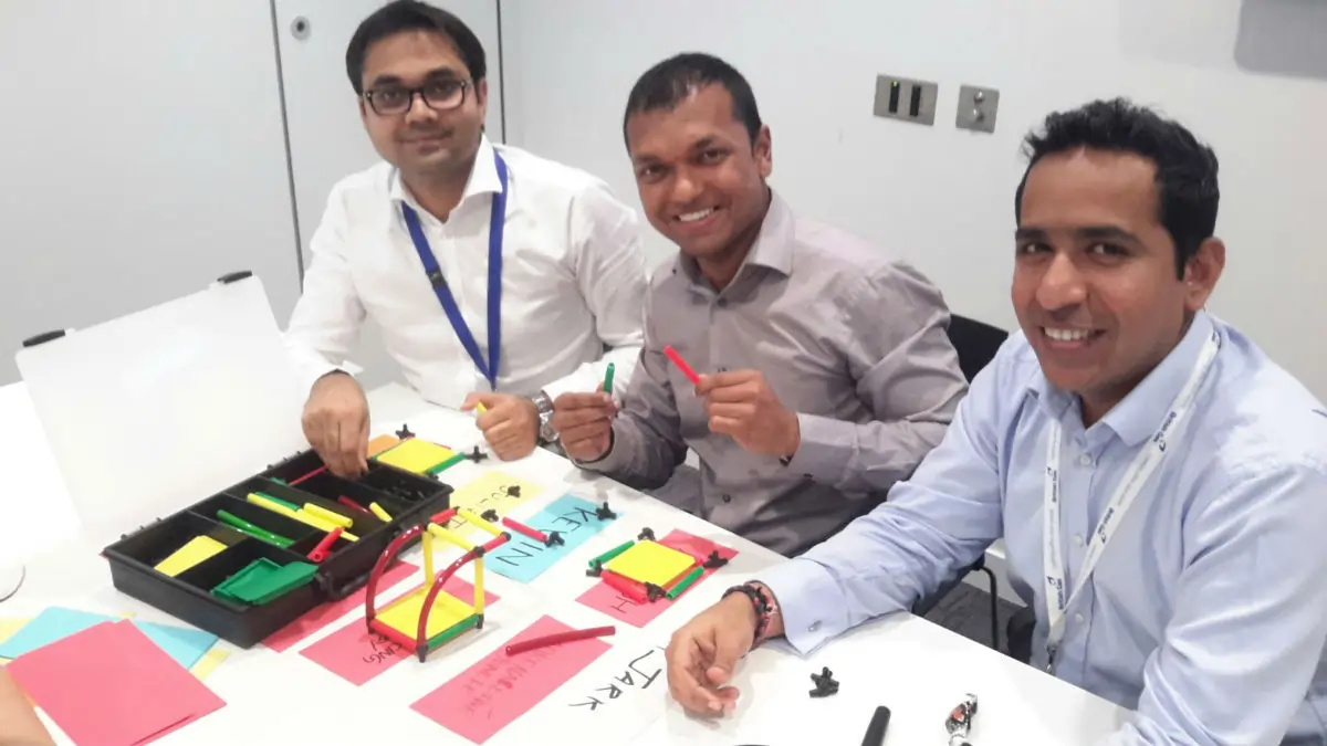 Participants engage in MTa KanDo Lean game, applying Lean thinking to improve processes and teamwork.