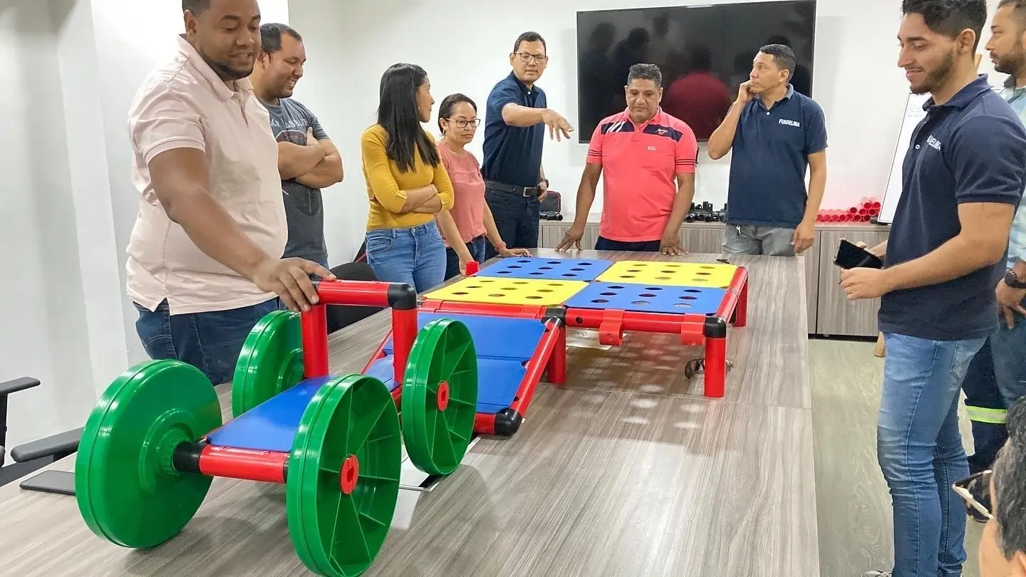 Team collaborating with the MTa Team kit to build a bridge, fostering teamwork and problem-solving.