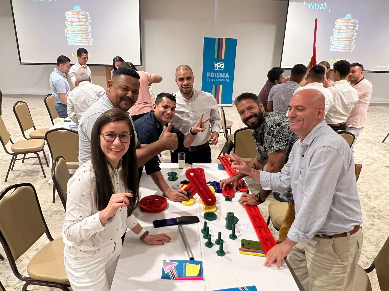 Participants engaging in a hands-on A3 or 8D workshop, collaborating to solve real-world problems.