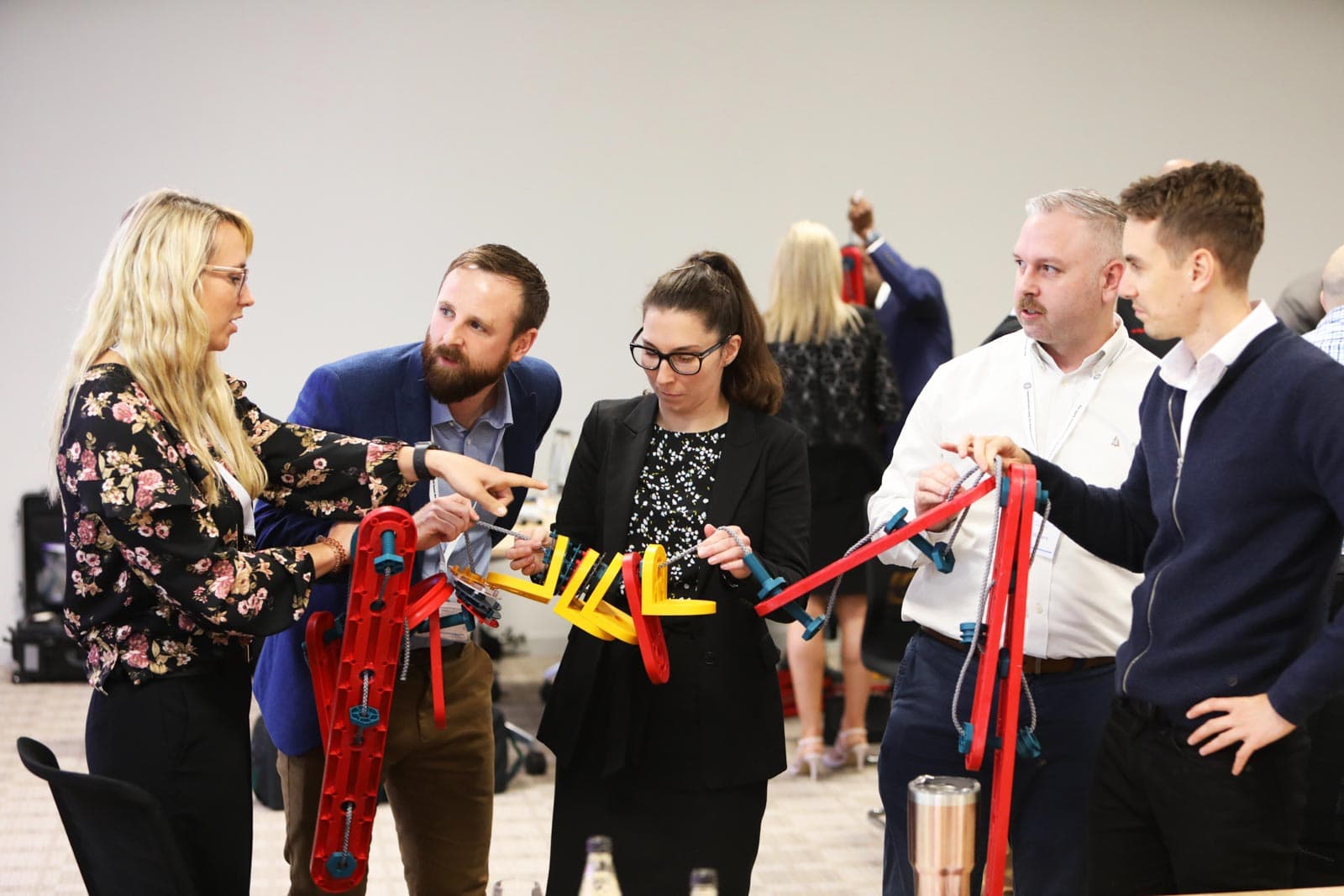 Employees engaged in a training activity using an MTa Learning kit