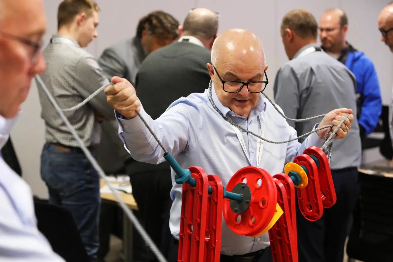 Male participant actively engaging with the MTa Insights kit to explore experiential learning.