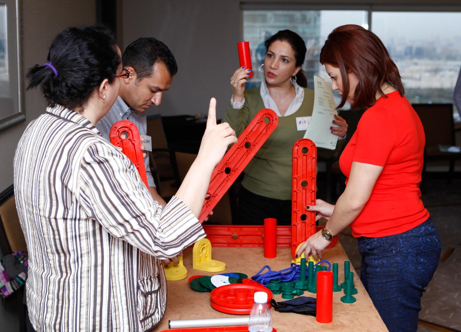 MTA Masterclass participants engaging in hands-on teamwork with MTa Insights kit for experiential learning.