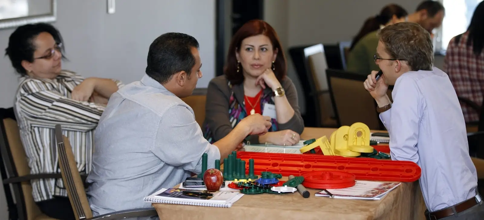 Group participating in MTa Insights' Seeing Red activity, highlighting pressure and personal traits.