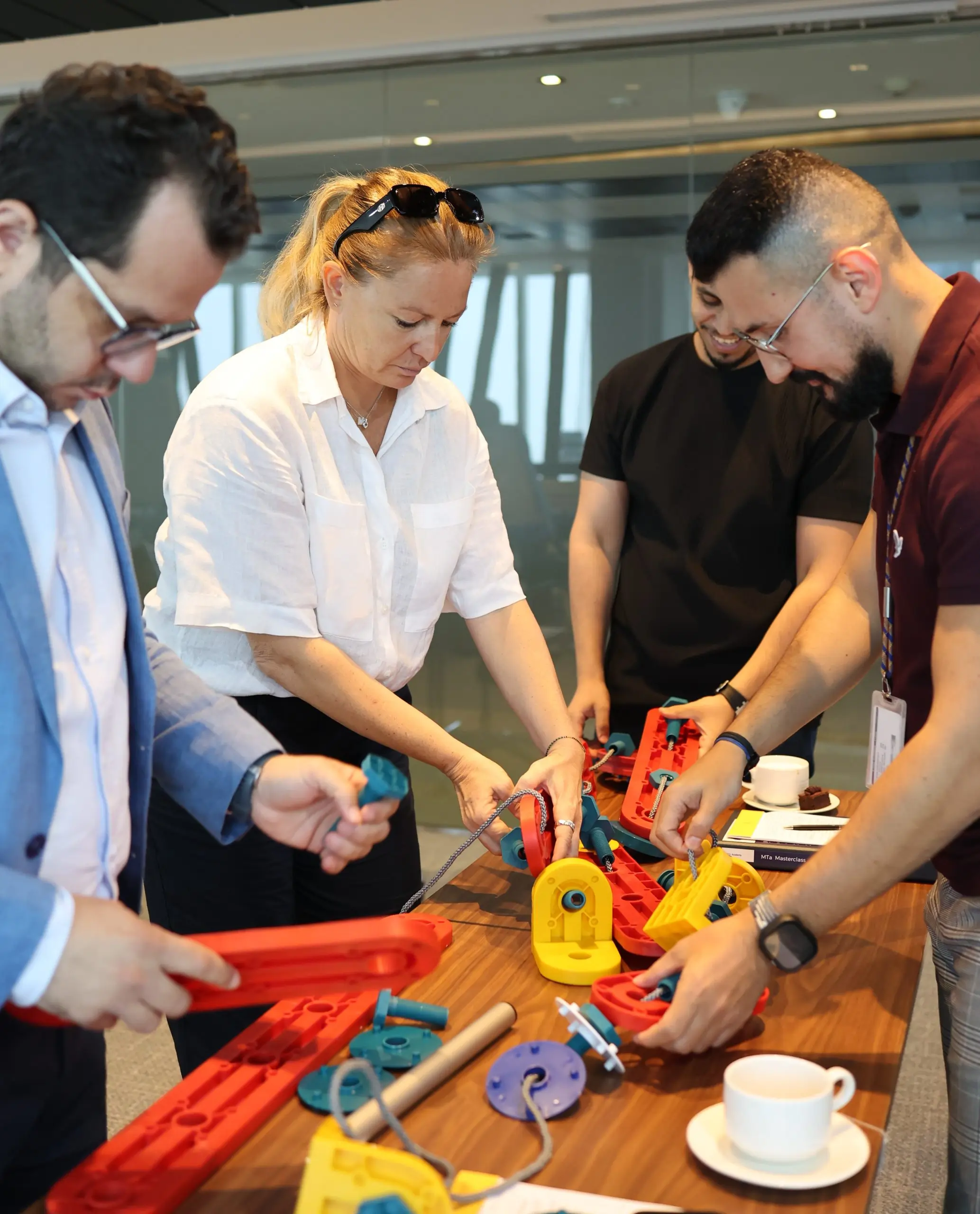 Participants engaging in experiential learning activities, collaborating and solving real-world challenges.