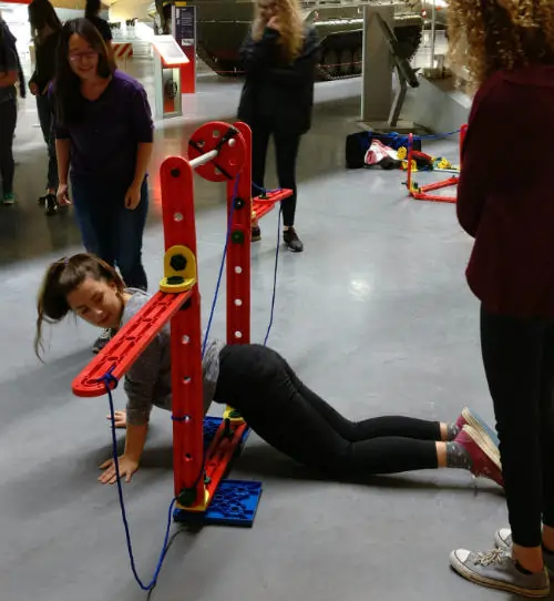 Royal Airforce cadets assembling structures with MTa STEM kits, fostering teamwork and engineering skills.