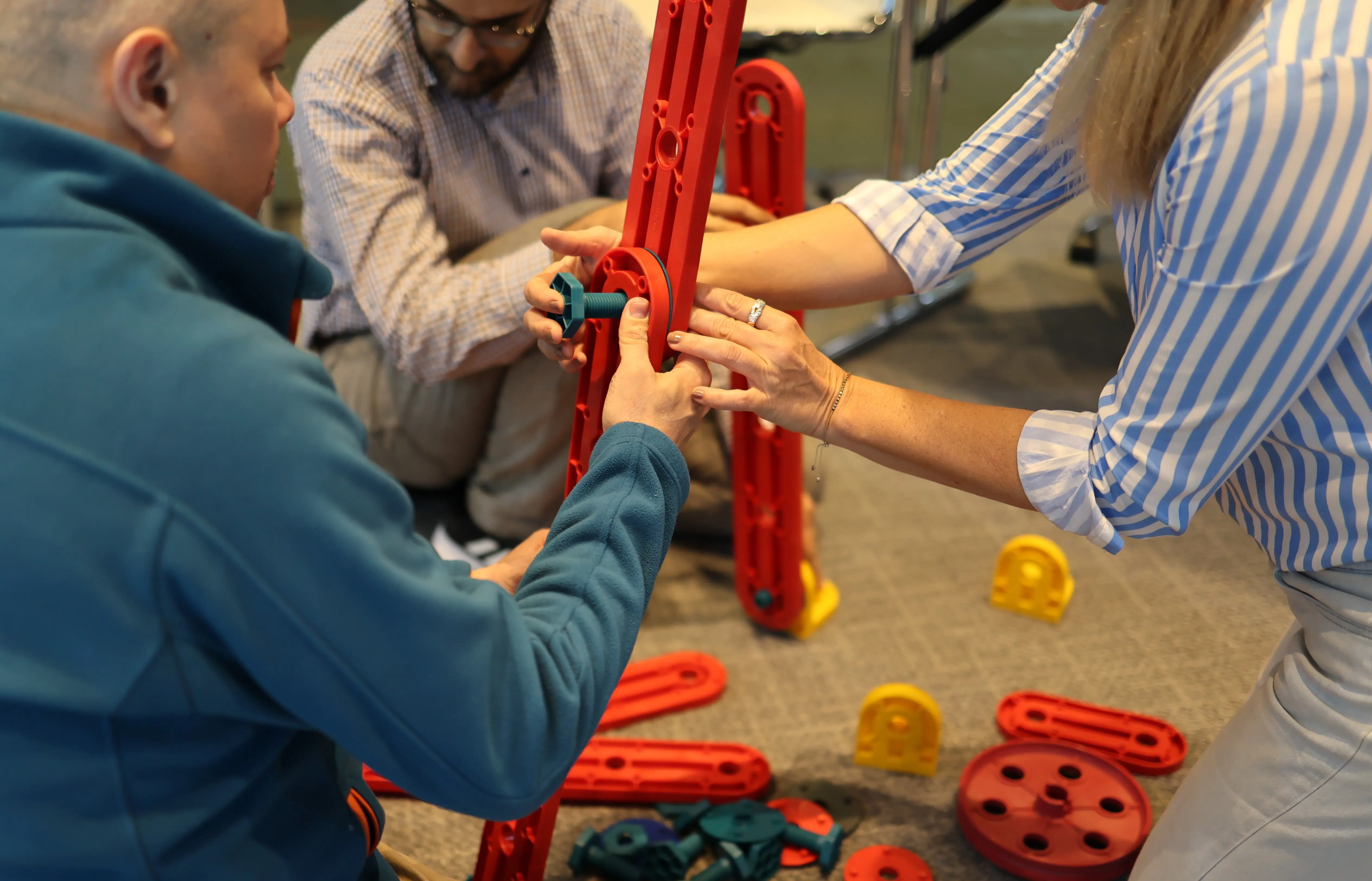 Participants collaborate in an MTa activity, enhancing communication skills through hands-on learning