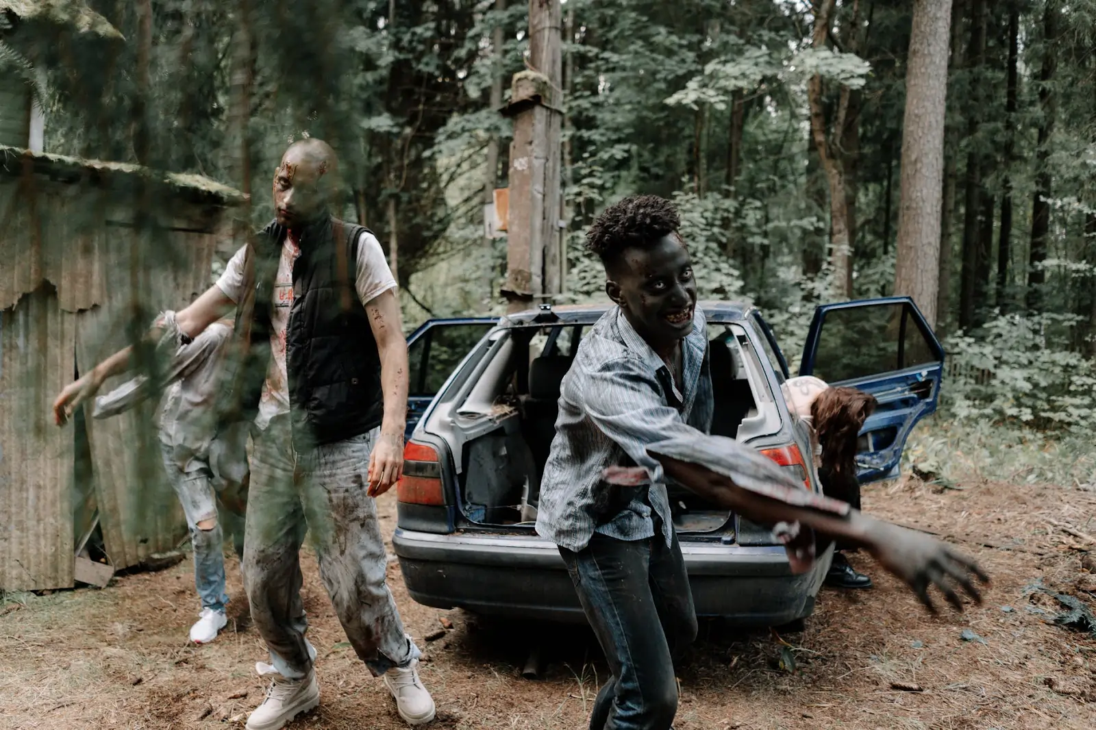 Kids dressed as zombies, actively participating in a STEM activity where they plan for a zombie apocalypse by evaluating the nutritional value and calorific content of food for survival.