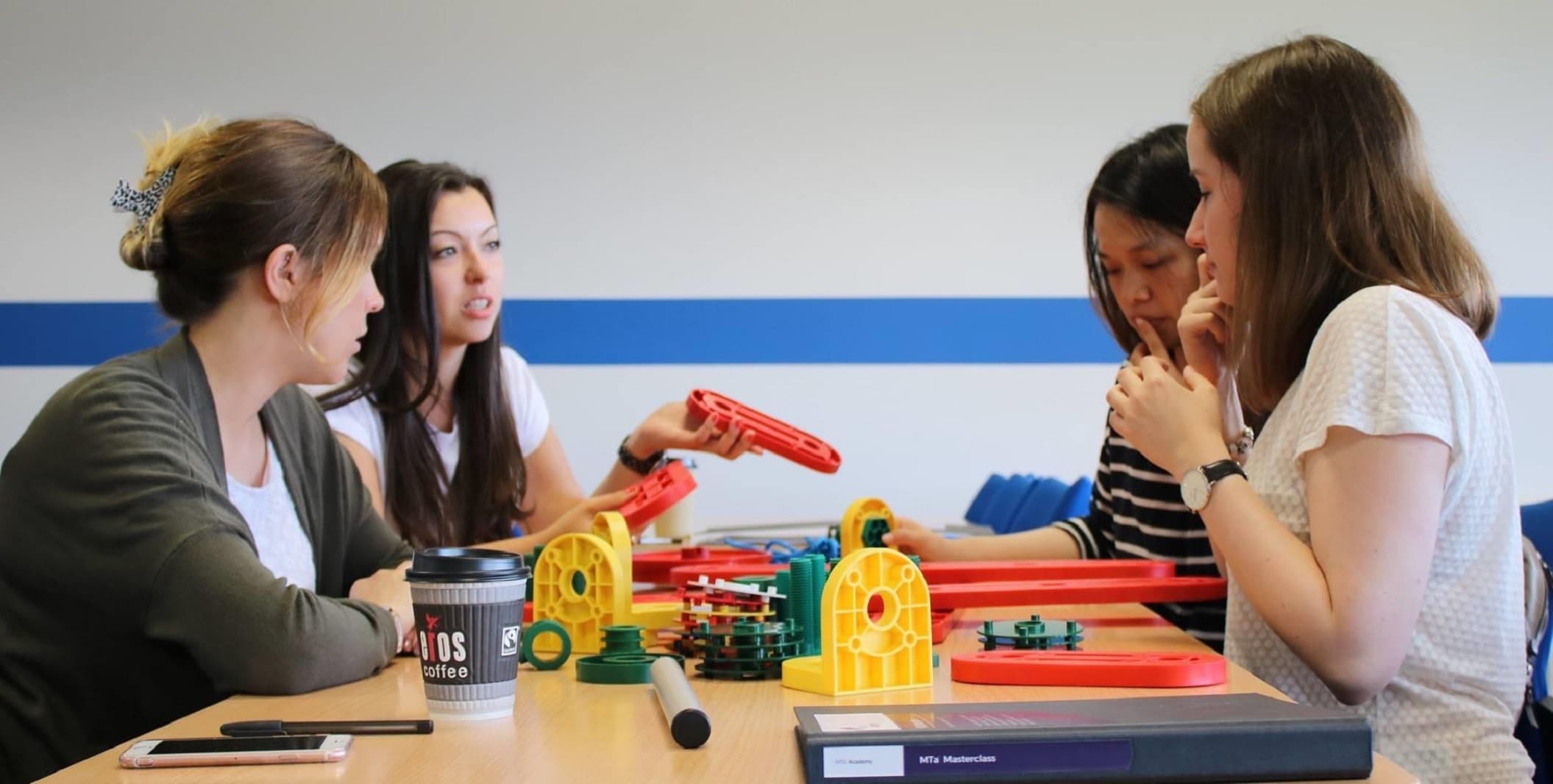 Employees engaged in a discussion whilst using an MTa Learning kit